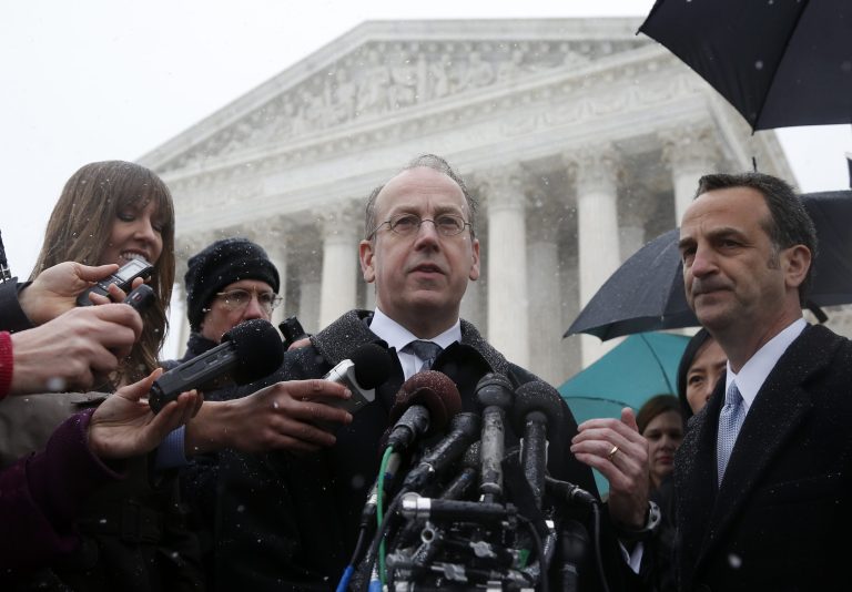 Paul Clement, attorney for Hobby Lobby and Conestoga Wood, center, speaks to reporters in front of the Supreme Court in Washington on Tuesday. (AP Photo/Charles Dharapak)