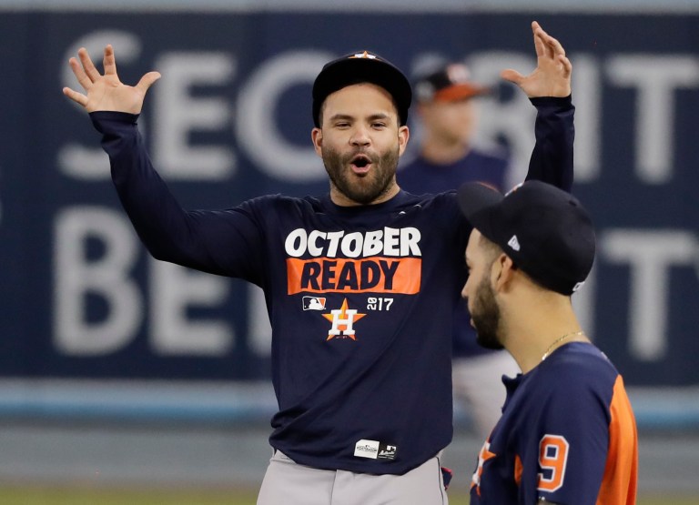 Houston Astros second baseman Jose Altuve, left, talks with left fielder Marwin Gonzalez during batting practice for baseball's World Series against the Los Angeles Dodgers, Monday, Oct. 23, 2017, in Los Angeles. (AP Photo/David J. Phillip)