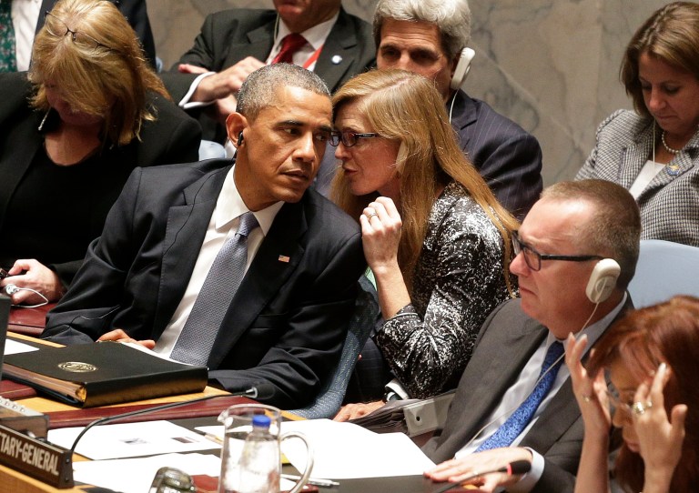 United States U.N. Ambassador Samantha Power, right, speaks to President Barack Obama during a UN Security Council meeting, Wednesday, Sept. 24, 2014, at the United Nations. Security Council members were expected to adopt a resolution that would require all countries to prevent the recruitment and transport of would-be foreign fighters preparing to join terrorist groups such as the Islamic State group. (AP Photo/Julie Jacobson)