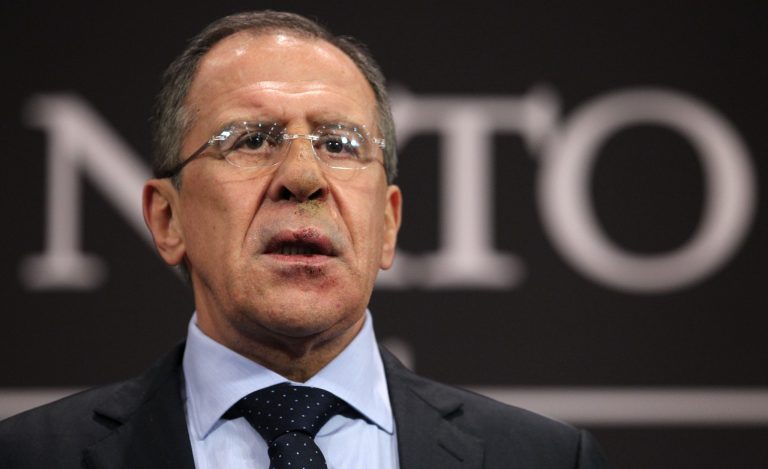   FILE- Russia's Foreign Minister Sergey Lavrov speaks at a media conference at NATO headquarters in Brussels, Belgium, in this file photo dated Tuesday, Dec. 4, 2012. Lavrov said Saturday Dec. 22, 2012, that the Syrian government has consolidated its chemical weapons to safeguard the arsenal at one or two locations, and also revealed that Russia has military advisers in the country and have kept close watch over its chemical weapons. (AP Photo/Yves Logghe, File)  
