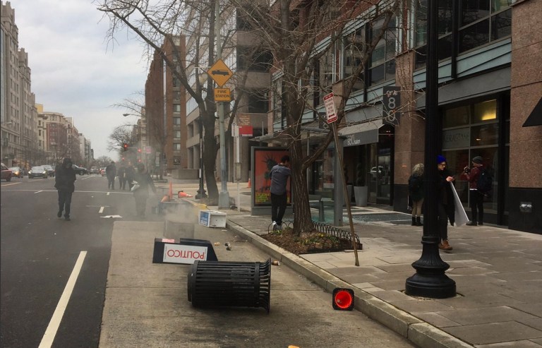 Protesters were seen vandalizing businesses and breaking windows in downtown Washington. (Screengrab)