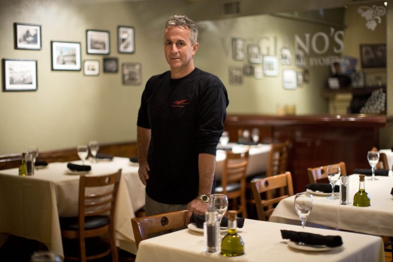In this Thursday, May 29, 2014 photo, Mark Viggiano, owner of Viggiano's Italian BYOB, poses for a portrait, in Conshohocken, Pa. Viggiano lost his restaurant during the recession and reopened it about a year ago. (AP Photo/Matt Rourke)