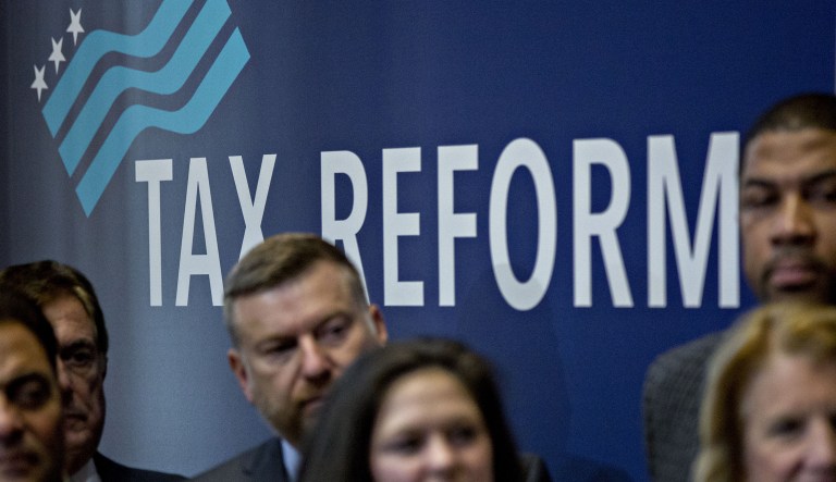 Republicans are counting on the Tax Cuts and Jobs Act to change the minds of unhappy voters who would prefer to have the Democrats in charge on Capitol Hill by an 11-point margin and consistently rate President Trump's job performance at around 40 percent, according to polling averages. (Andrew Harrer/Bloomberg)