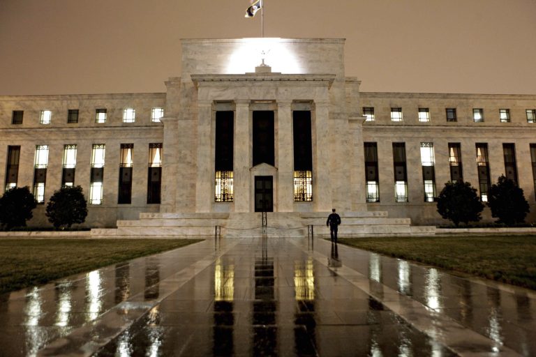 FILE - This March 27, 2009 file photo, shows the Federal Reserve Building on Constitution Avenue in Washington. After a 16-day partial government shutdown and a batch of tepid economic data, no one thinks the Fed is ready to reduce its stimulus when it meets Tuesday and Wednesday, Oct. 29-30, 2013. Many analysts now predict it will maintain the pace of the bond purchases into next year.  (AP Photo/J. Scott Applewhite, File)