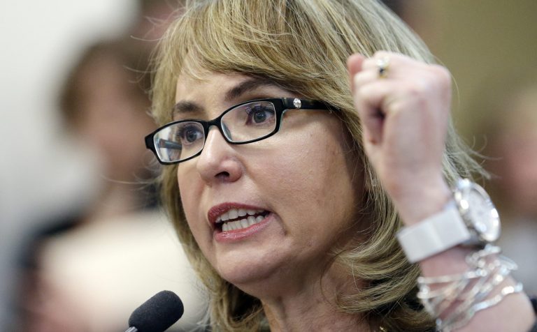 FILE - In this Jan. 28, 2014, file photo, former Arizona Rep. Gabrielle Giffords testifies before a Washington state House panel in Olympia, Wash. Gun control groups say this is the year they finally go toe-to-toe with the National Rifle Association and match their foe's imposing campaign spending for congressional candidates. Americans for Responsible Solutions, headed by Giffords and husband Mark Kelly, the one-time astronaut, has said it will at least match the $20 million the NRA spent during the entire 2012 campaign, which included a presidential race. (AP Photo/Elaine Thompson)