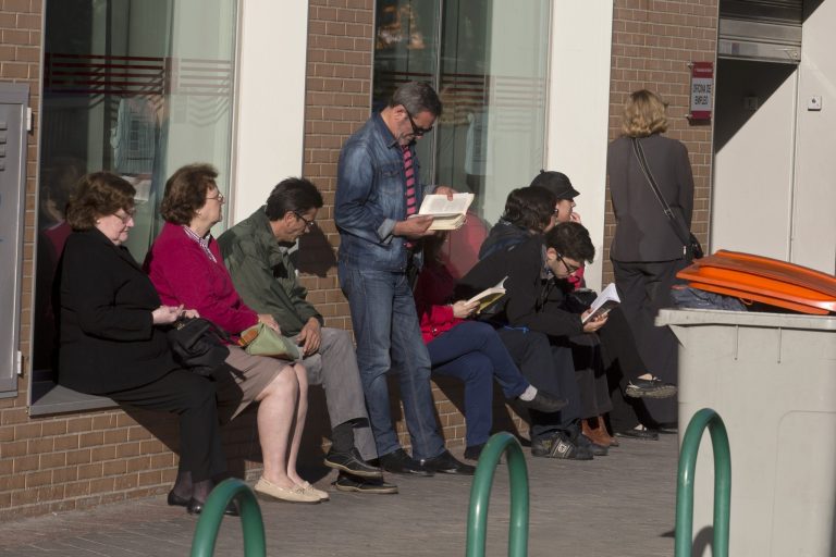 People wait for a government-run unemployment registry office to open, in Madrid, Spain, Tuesday, April 29, 2014. Spain's National Statistics Institute said the unemployment rate edged up to 25.9 percent in the first three months of the year from 25.7 percent in the previous quarter, a sign the recovery is still weak. The institute said Tuesday the number of people out of work fell by 2,300 in the January-March period, leaving the total number of unemployed at a rounded 5.9 million. (AP Photo/Paul White)