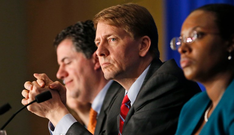 After unexpectedly being cut off from student loan data by the Department of Education last week, Consumer Financial Protection Bureau director Richard Cordray is seeking to mend the fence, arguing that the two departments would work better together. (AP Photo/Steve Helber, File)