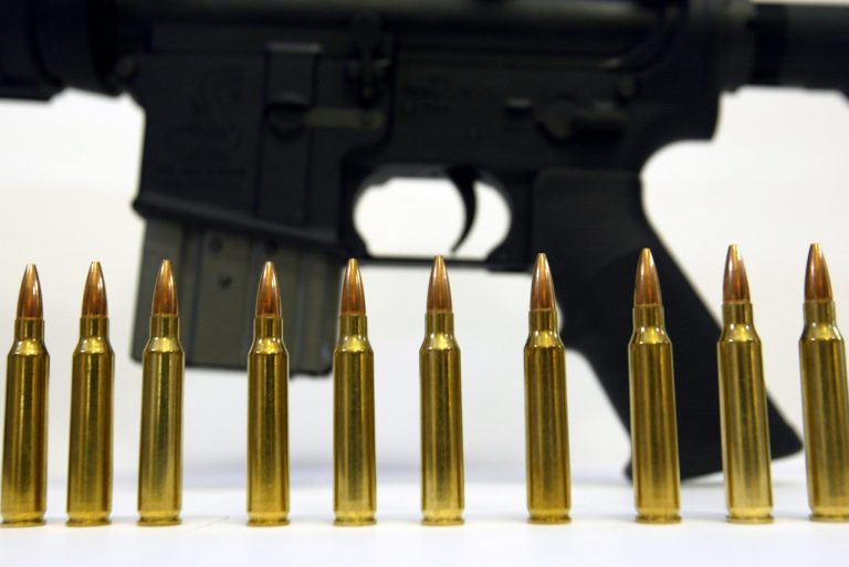 HOLLYWOOD, FLORIDA - OCTOBER 25:  Several .223 caliber rounds are shown near a Bushmaster XM-15 October 25, 2002 in Hollywood, Florida. They are similar to the ones that were being used by the sniper during a killing spree near Washington, D.C. Famous for its use in the military's M-16 rifle, the .223-caliber round is known for causing extensive tissue damage.  (Photo by Joe Raedle/Getty Images)