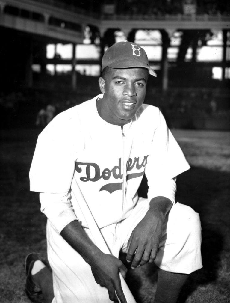 Jackie Robinson of the Brooklyn Dodgers poses at Ebbets Field in Brooklyn. Former Vice President Al Gore says he and Robinson are alike in that the were criticized as the messengers of 