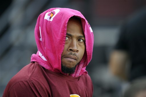 Washington Redskins wide receiver Pierre Garcon (88) watches from the sidelines during the first half of an NFL football game against the Minnesota Vikings Sunday, Oct. 14, 2012, in Landover, Md. (AP Photo/Cliff Owen)