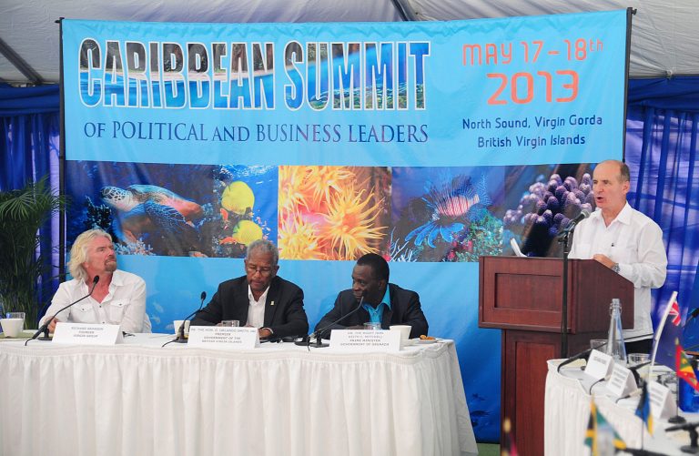 From left, Richard Branson, British Virgin Islands Premier Dr. Orlando Smith, and Grenada Prime Minsiter Dr. Keith Mitchell listen to Costa Rica's former President and businessman Jose Maria Figueres speak during a Caribbean Summit of Political Business Leaders? at the home of Richard Branson on Necker Island, in the British Virgin Islands, Friday, May 17, 2013. 