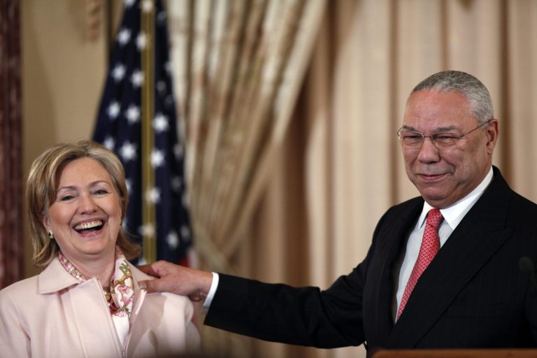 Former Secretary of State Colin Powell shares a laugh with Secretary of State Hillary Rodham at the State Department in Washington, Monday, Dec. 7, 2009, during a ceremony where his official portrait was unveiled. (AP Photo/J. Scott Applewhite)