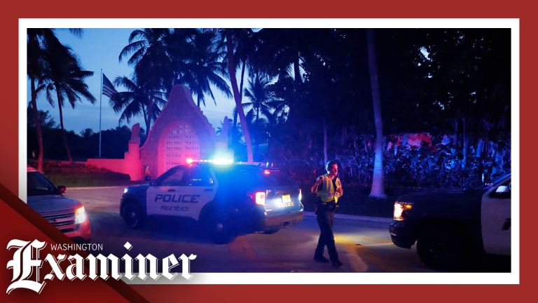 Police direct traffic outside an entrance to former President Donald Trump's Mar-a-Lago estate, Monday, Aug. 8, 2022, in Palm Beach, Fla.