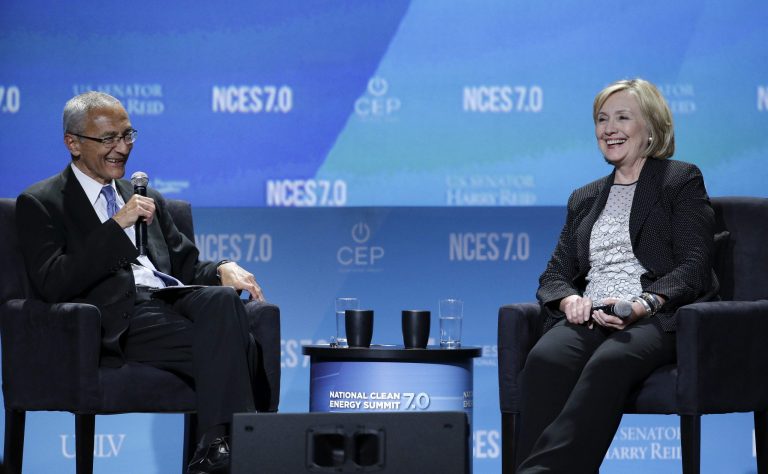 Former Secretary of State Hillary Clinton, right, takes questions from John Podesta, counselor to President Obama, at the National Clean Energy Summit Thursday in Las Vegas. (AP Photo/John Locher)