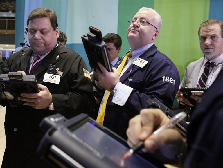   Traders work on the floor of the New York Stock Exchange Tuesday, Dec. 11, 2012. Stocks opened higher Tuesday ahead of a meeting of the Federal Reserve and possible additional steps to bolster the U.S. economy. (AP Photo/Richard Drew)  