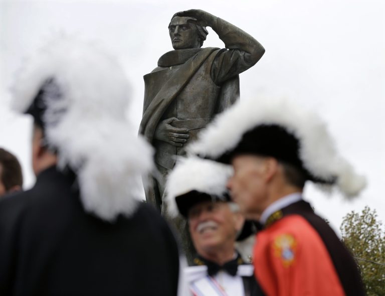 Members the Knights of Columbus gather near a statue of Christopher Columbus during the 13th annual Columbus Day Commemoration Monday, Oct. 13, 2014, in Trenton, N.J. (AP Photo/Mel Evans)