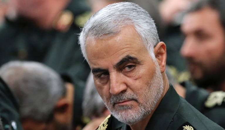 FILE- In this Sept. 18, 2016 photo released by an official website of the office of the Iranian supreme leader, Revolutionary Guard Gen. Qassem Soleimani, center, attends a meeting with Supreme Leader Ayatollah Ali Khamenei and Revolutionary Guard commanders in Tehran, Iran. A U.S. airstrike near Baghdad's airport on Friday Jan. 3, 2020 killed Gen. Qassem Soleimani, the head of Iran's elite Quds Force. Soleimani was considered the architect of Iran's policy in Syria. (Office of the Iranian Supreme Leader via AP, File)