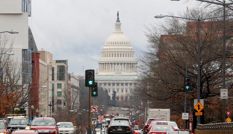 Commuter traffic on North Capitol Street heading towards the US Capitol Building in Washington resumes to its normal volume, Tuesday, Jan. 23, 2018. The bill to reopen the government late Monday, was signed by President Donald Trump, ending a 69-hour display of partisan dysfunction.