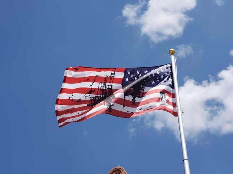 The University of Kansas flies a defaced American flag in the name of art.