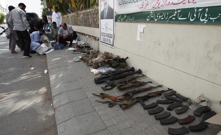 Pakistani security forces examine ammunition confiscated from attackers who stormed late Sunday the Jinnah International Airport, during their investigation in Karachi, Pakistan, Monday, June 9, 2014. The Pakistani Taliban on Monday claimed responsibility for a brazen five-hour assault on the country's busiest airport that saw gunmen disguised as police guards storm the international terminal in Karachi, set off explosions and killing over a dozen of people. (AP Photo/Fareed Khan)