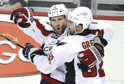 Gene J. Puskar/AP
Dennis Wideman scored the game-winning goal on a power play in overtime as the Caps beat the Penguins on Thursday.
