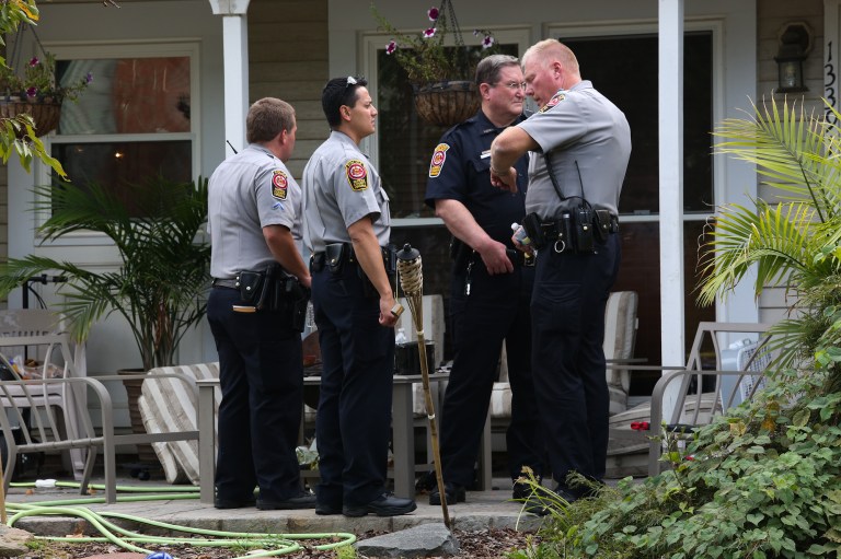 Fairfax County police at the scene of a family home where they say four people were found dead in Herndon on Sept. 25. (Graeme Jennings/Examiner)