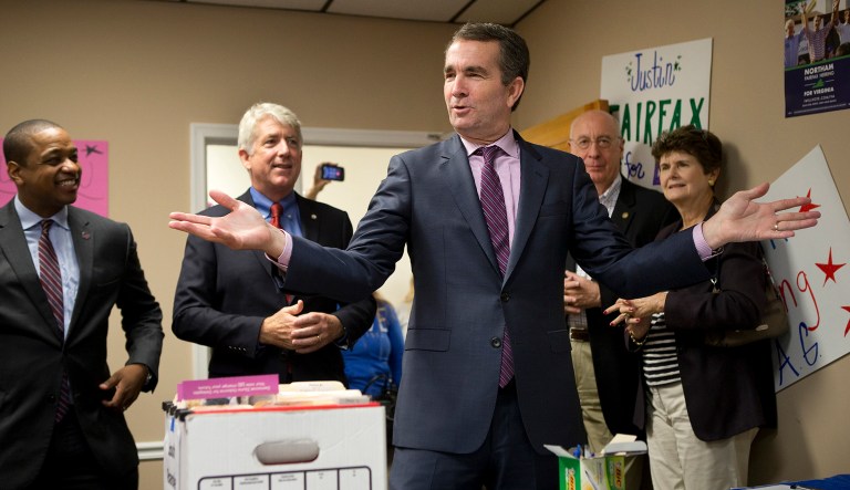 Virginia Lt. Gov. Ralph Northam speaks to volunteers ready to canvas neighborhoods the day before elections. With little mention of the economy or the GOP tax overhaul, Democrats focused on the man in the White House and the racially charged issues raised by Republican Ed Gillespie. (Erica Yoon/The Roanoke Times via AP)