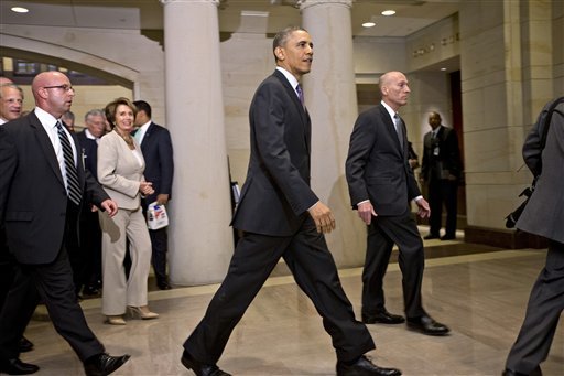 President Barack Obama and House Minority Leader Nancy Pelosi, D-Calif., left, leave a meeting with House Democrats at the Capitol, in Washington, Thursday, March 14, 2013. (AP Photo/J. Scott Applewhite)