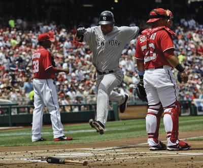 Alex Brandon/APYankees shortstop Derek Jeter scored on a sacrifice fly as the Yankees completed a sweep of the Nationals on Sunday.