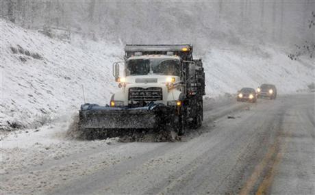 Snow from Hurricane Sandy covered parts of Virginia and West Virginia. Here, a snow plow moves through the mountains of West Virginia. (AP Photo/Robert Ray)