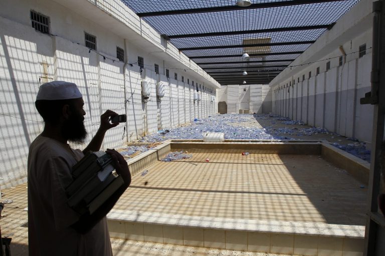 A Libyan man takes pictures of the courtyard of Abu Salim prison in Tripoli, Libya, in August 2011. Human Rights Watch said it had uncovered evidence of a wider use of waterboarding in American interrogations of detainees than has been acknowledged by the United States. (AP Photo/Francois Mori, File)