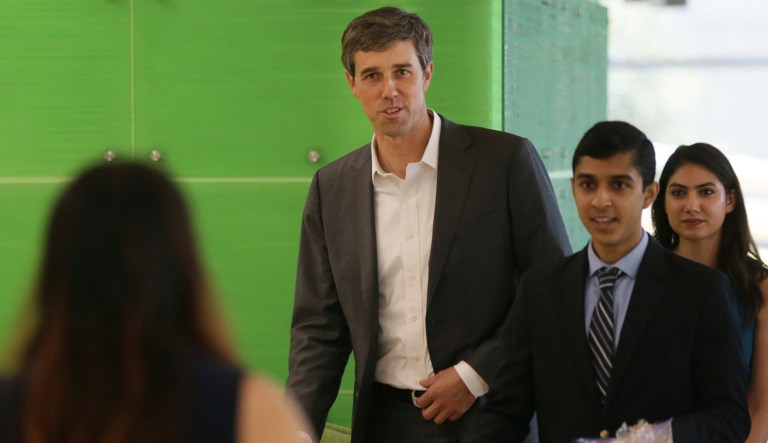 U.S. Rep. Beto O'Rourke, D-Texas, of El Paso, Texas, center, arrives to speaks to students at the University of Texas at Dallas Wednesday, Sept. 20, 2017, in Richardson, Texas. The three-term, fluent Spanish-speaker is seeking to unseat Texas Republican Sen. Ted Cruz in 2018. (AP Photo/LM Otero)