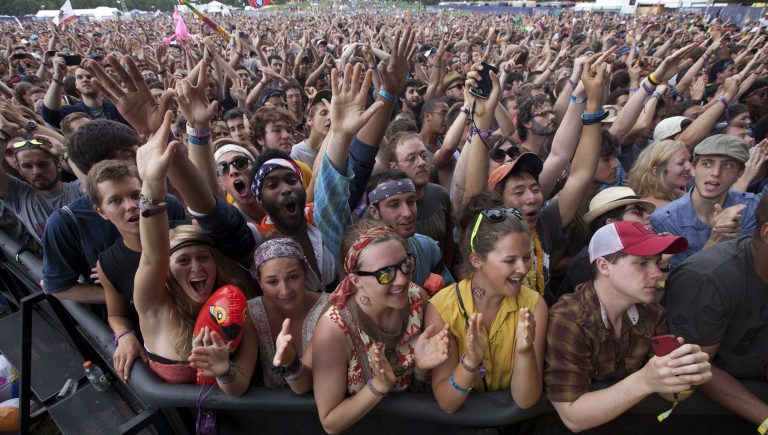   Music fans react as Bon Iver performs during the Bonnaroo Music and Arts Festival in Manchester, Tenn., Sunday, June 10, 2012. (AP Photo/Dave Martin)  