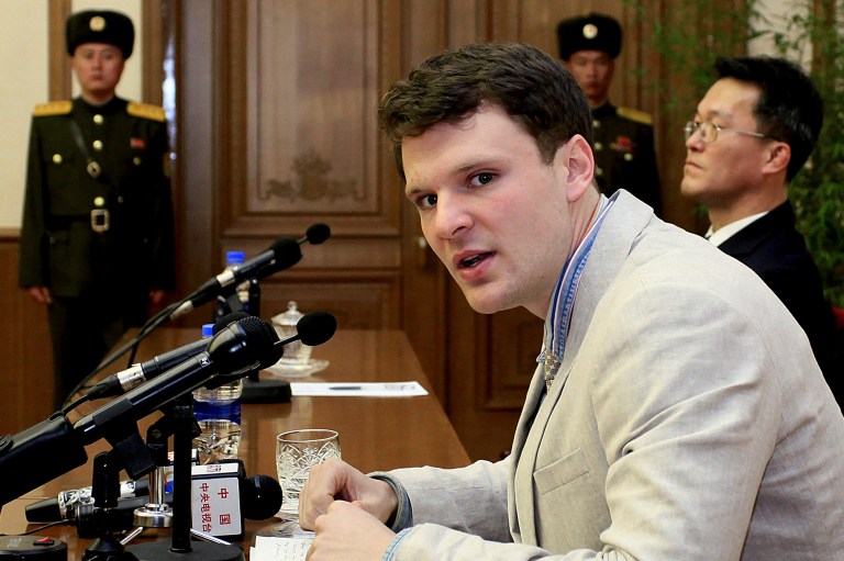 The 21-year-old had been arrested by Korean authorities in January when he had moved to travel back to the U.S. Warmbier told reporters he had taken the banner 
