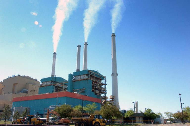 FILE - In this July 1, 2013, file photo,  smoke rises from the Colstrip Steam Electric Station, a coal burning power plant in in Colstrip, Mont. State officials planned a public meeting Tuesday, Sept. 30, 2014, in Colstrip on the U.S. Environmental Protection Agency proposal to cut greenhouse emissions. The town is home to one of the largest coal-fired power plants in the West,  a 2,100-megawatt facility that churns out more greenhouse gases than any other source in Montana.