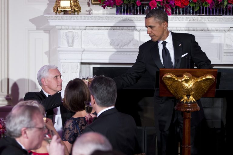 President Barack Obama, right, and Gov. Mike Pence, R-Ind., toast during a dinner for the National Governors Association in the State Dining room of the White House on Sunday, Feb. 23, 2014, in Washington. (AP Photo/ Evan Vucci)