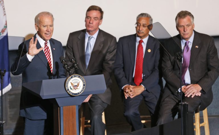 Vice President Joe Biden, left, gestures during a speech on infrastructure as U.S. Sen. Mark Warner, D-Va., second from left, Congressman, Bobby Scott, D-Va., and Virignia Gov. Terry McAuliffe, right, listen, Wednesday, Sept. 24, 2014, in Norfolk, Va. Biden visited the area to talk about a new federal transportation grant. (AP Photo/Steve Helber)