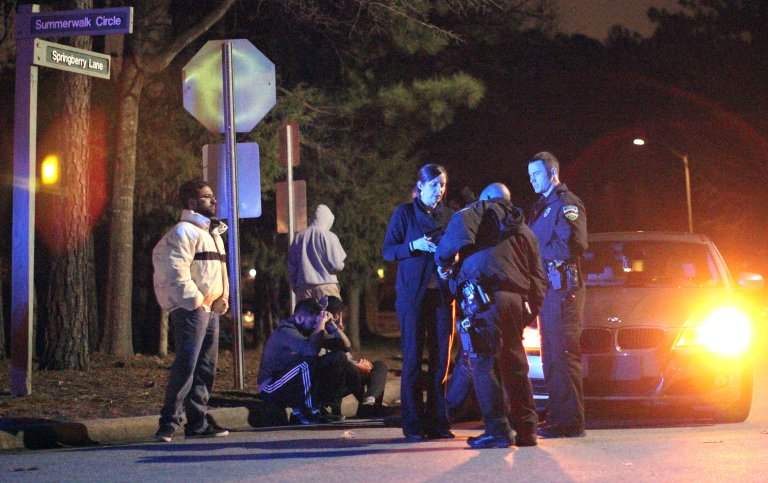 In this Tuesday, Feb. 10, 2015 photo, Chapel Hill police officers investigate the scene of three murders near Summerwalk Circle in Chapel Hill, N.C. (AP Photo/The News & Observer, Al Drago)
