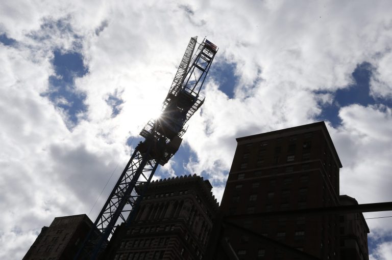 In this photo made on Monday, Sept. 22, 2014, work continues at a construction site in Pittsburgh. The Commerce Department releases construction spending for August on Wednesday, Oct. 1, 2014. (AP Photo/Keith Srakocic)