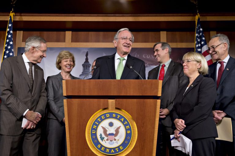 There were smiles all around as Democrats gathered after the Senate cut off debate to move toward a historic vote on legislation outlawing workplace discrimination against gay, bisexual and transgender Americans, demonstrating the nation's quickly evolving attitude toward gay rights nearly two decades after Congress rejected same-sex marriage, on Capitol Hill in Washington, Thursday, Nov. 7, 2013. From left are, Senate Majority Leader Harry Reid, D-Nev., Sen. Tammy Baldwin, D-Wis., Sen. Tom Harkin, D-Iowa, Sen. Jeff Merkley, D-Ore., Sen. Patty Murray, D-Wash., Sen. Charles Schumer, D-N.Y. The enthusiasm of the bill's supporters was tempered by the reality that the Republican-led House, where conservatives have a firm grip on the agenda, is unlikely to even vote on it.  (AP Photo/J. Scott Applewhite)