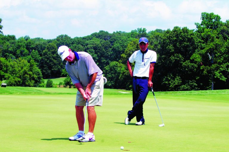 Kevin Dunleavy/The Washington Examiner
Ji Soo Park watched his coach at Virginia, Bowen Sargent, sink a birdie putt on Tuesday.