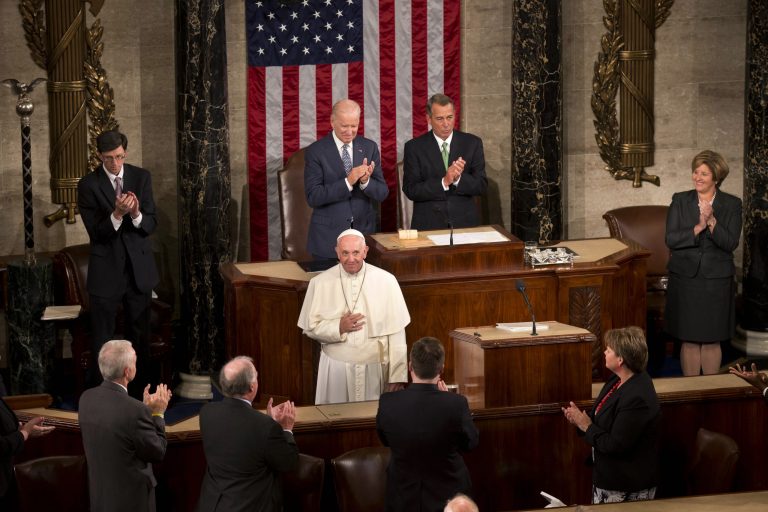 Pope Francis listens to applause before addressing a joint meeting of Congress on Capitol Hill in Washington, Thursday, Sept. 24, 2015, making history as the first pontiff to do so. (AP Photo/Alessandra Tarantino)