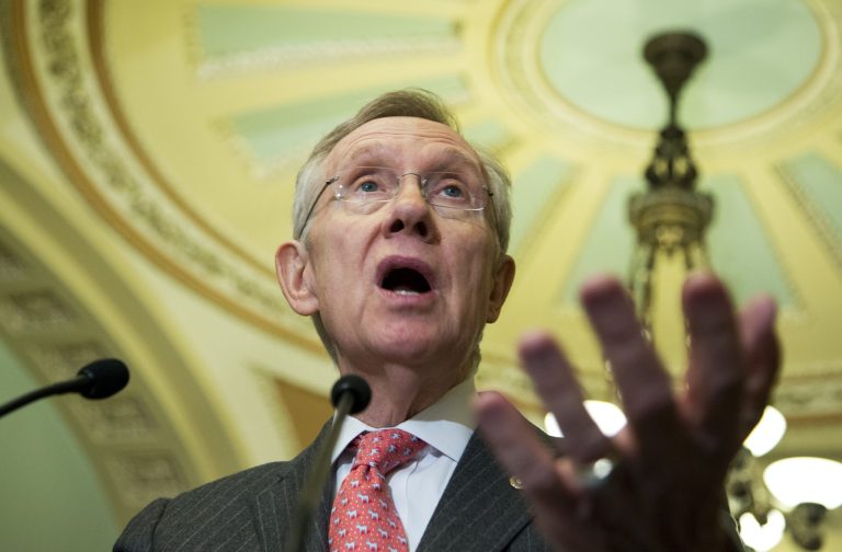 Senate Majority Leader Sen. Harry Reid of Nev gestures as he speaks to reporters on Capitol Hill.   (AP Photo/Manuel Balce Ceneta)