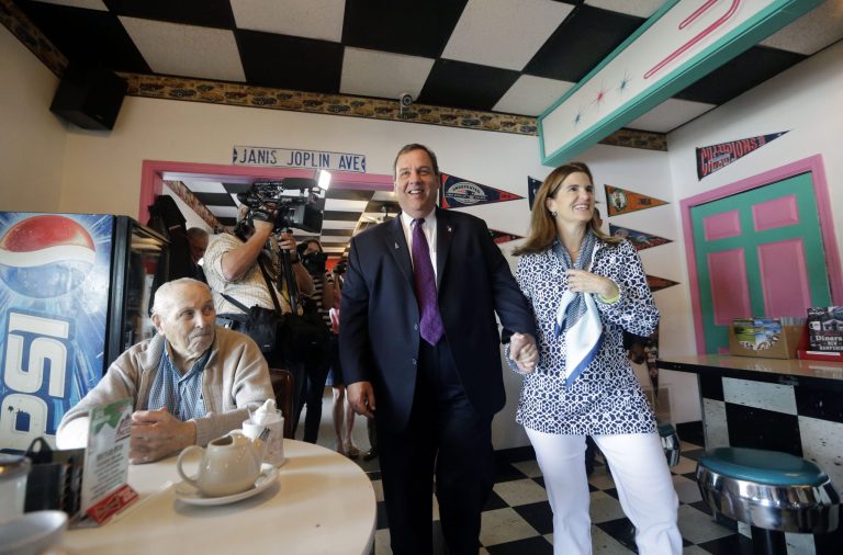 Republican presidential candidate New Jersey Gov. Chris Christie walks into the Pink Cadillac Diner with his wife Mary Pat for a campaign town hall meeting, Thursday, July 2, 2015, in Rochester, N.H. (AP Photo/Elise Amendola)