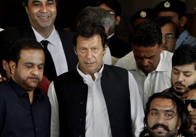 FILE - In this Wednesday, Aug. 28, 2013 file photo, Cricketer-turned-politician and head of Pakistan Tehree-e-Insaf or Moment for Justice Imran Khan, center, leaves the Supreme Court after his case hearing in Islamabad, Pakistan. The Pakistani Taliban named five well-known political and religious figures including ex-cricketer Khan to represent them in peace talks with the government, the militant group said Sunday. (AP Photo/Anjum Naveed, File)