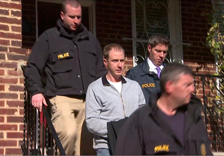 FILE - In this Wednesday, Dec. 11, 2013 file image taken from video and released by WJLA TV, U.S. Postal police walk with Ryan Loskarn, center, in Washington. Loskarn, the fired chief of staff for Sen. Lamar Alexander of Tennessee, is returning to court in Washington Monday, Dec. 16, 2013, after his arrest on charges of possession and attempted distribution of child pornography.. (AP Photo/WJLA TV, File)