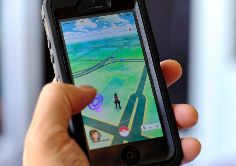 Pokemon Go has jumped to become the top-grossing app in the App Store. (AP Photo/Richard Vogel)