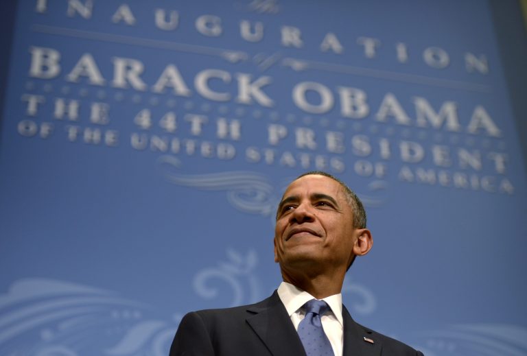WASHINGTON, DC - JANUARY 20: (AFP OUT) U.S. President Barack Obama listens as First Lady Michelle Obama delivers remarks at the Inaugural Reception at the National Building Museum on January 20, 2013 in Washington, D.C. (Photo by Shawn Thew-Pool/Getty Images)