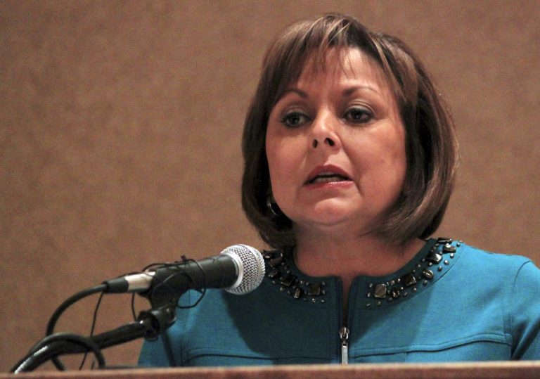 Gov. Susana Martinez announces that New Mexico will expand its Medicaid program during a speech at a children's law and welfare conference in Albuquerque, N.M., on Wednesday, Jan. 9, 2013. Martinez announced during the conference that New Mexico plans to follow provisions of a federal health care law to expand Medicaid to potentially provide medical services to 170,000 low-income adults. (AP/Susan Montoya Bryan)