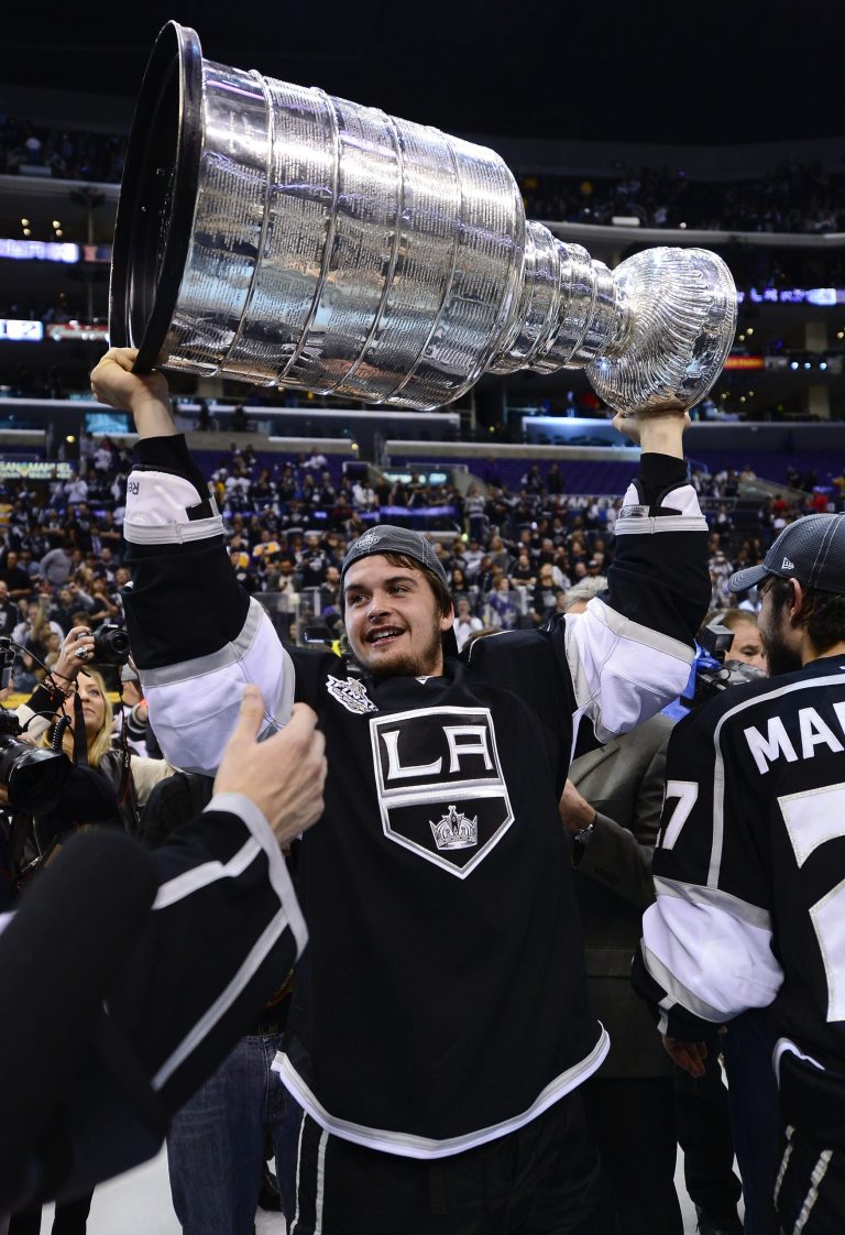   Los Angeles Kings center Andrei Loktionov (48) holds up the Stanley Cup after the Kings beat the New Jersey Devils 6-1 during Game 6 of the NHL hockey Stanley Cup finals, Monday, June 11, 2012, in Los Angeles. (AP Photo/Mark J. Terrill)  